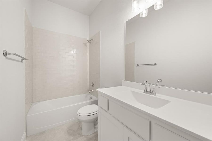Full bathroom with vanity, bathing tub / shower combination, and tile patterned flooring Full bathroom with vanity, bathing tub / shower combination, and tile patterned flooring