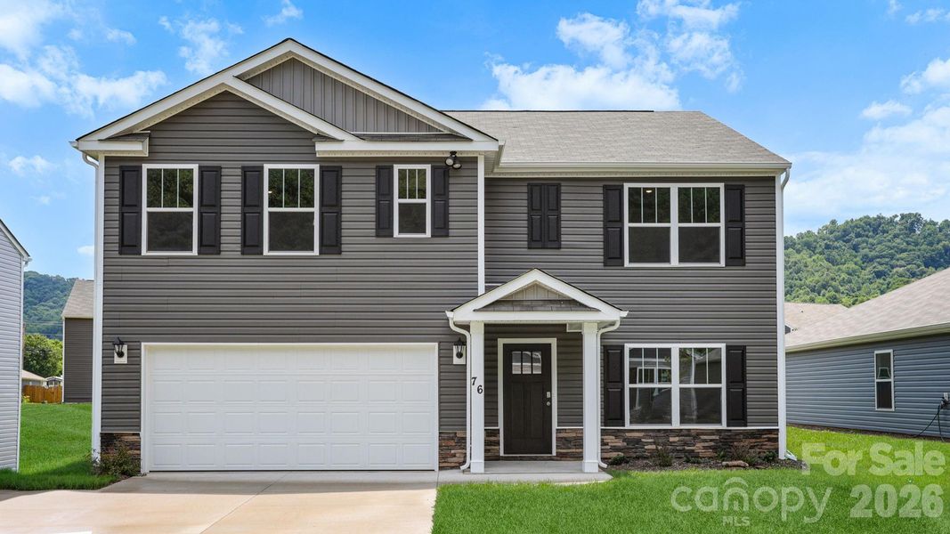 Front exterior of a new home in Wildbrook Village, Waynesville, NC, highlighting curb appeal (Image 1). Front exterior of a new home in Wildbrook Village, Waynesville, NC, highlighting curb appeal (Image 1).