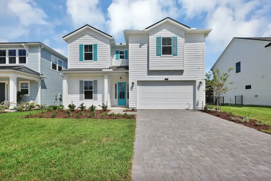 Representative exterior photo of a completed home built from the Crescent by Riverside Homes in Sagebrush at EverRange, Jacksonville, FL (Image 23).
