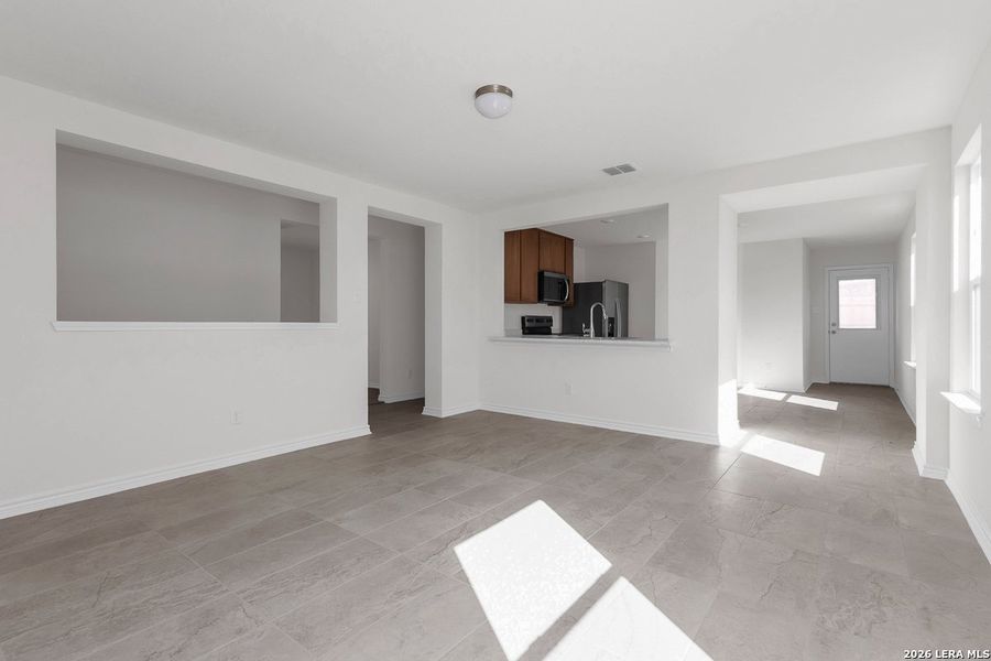 Spacious, unfurnished interior of a new home in Hidden Bluffs at TRP, San Antonio (Image 13).
