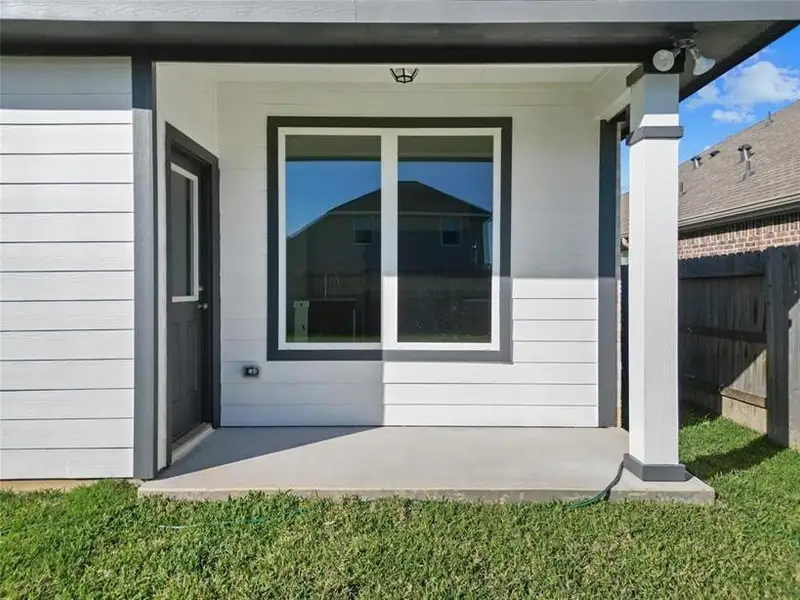 Exterior details and patio area of a home in Ladera Creek, Conroe (Image 1).