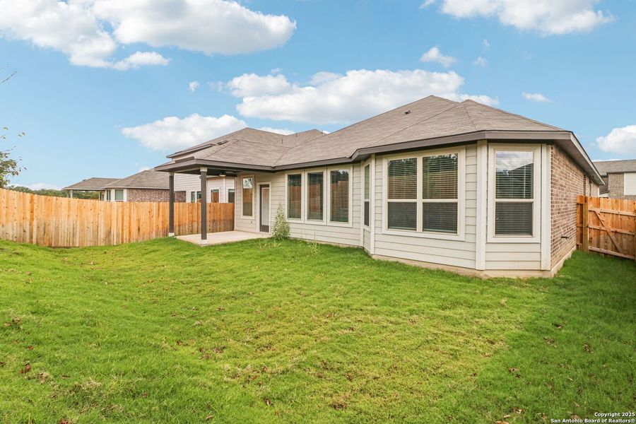 Exterior details and patio area of a home in Fox Falls, Boerne (Image 24).
