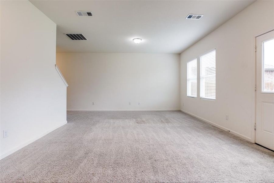 Spare room featuring carpet floors