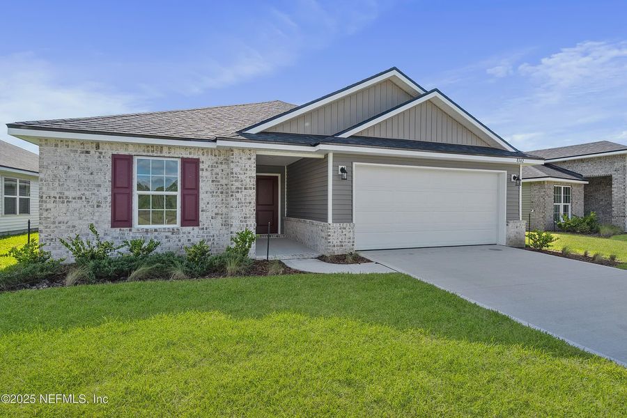 Front exterior of a new home in Summerglen, Jacksonville, FL, highlighting curb appeal (Image 2). Front exterior of a new home in Summerglen, Jacksonville, FL, highlighting curb appeal (Image 2).