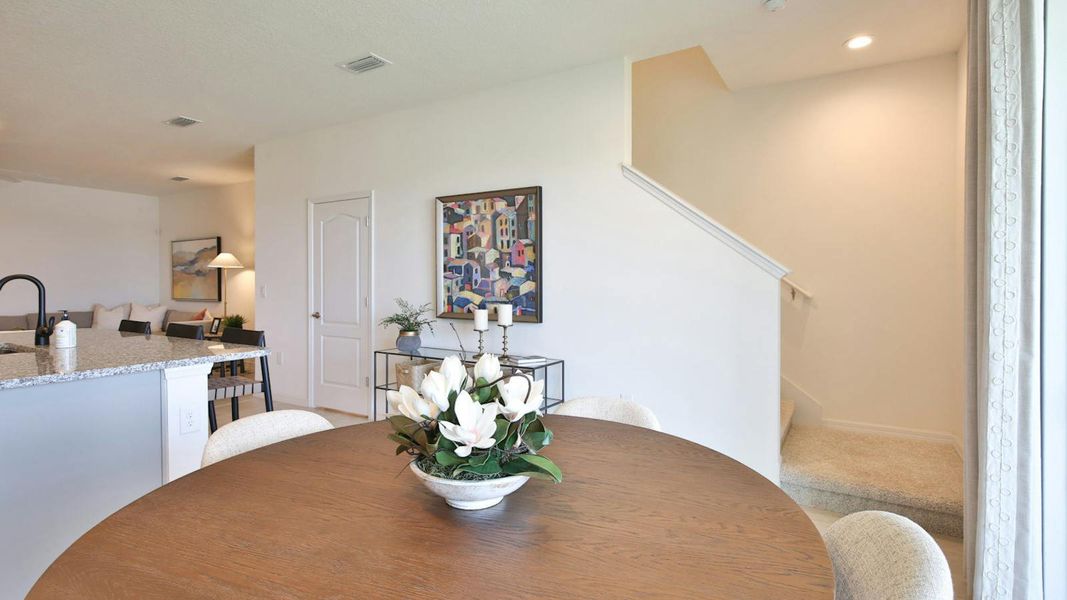 Furnished interior view inside a new home in Palm Grove Real Estate and Homes for Sale in Lakewood Ranch, FL - Neal Communities, Lakewood Ranch (Image 18).