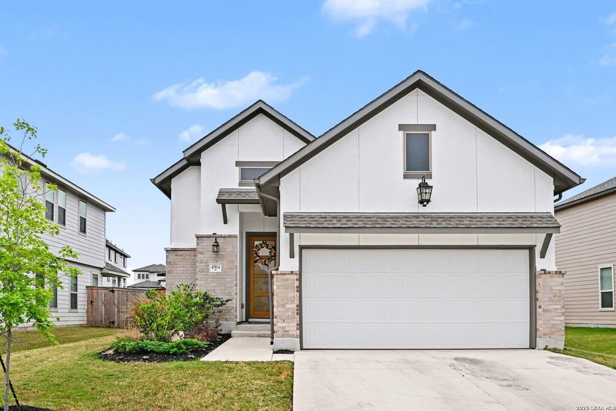Front exterior of a new home in The Parklands, Schertz, TX, highlighting curb appeal (Image 21).