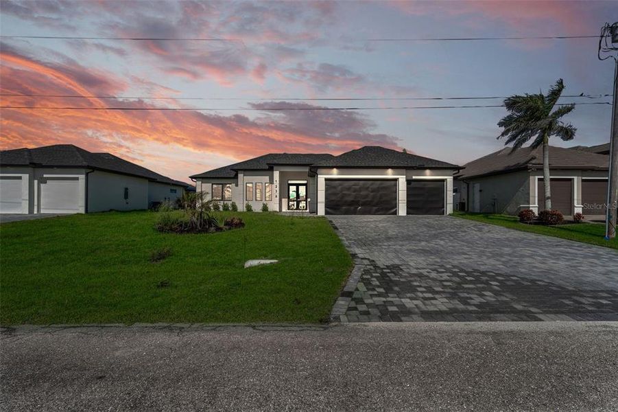 Front exterior of a new home in , Cape Coral, FL, highlighting curb appeal (Image 1). Front exterior of a new home in , Cape Coral, FL, highlighting curb appeal (Image 1).