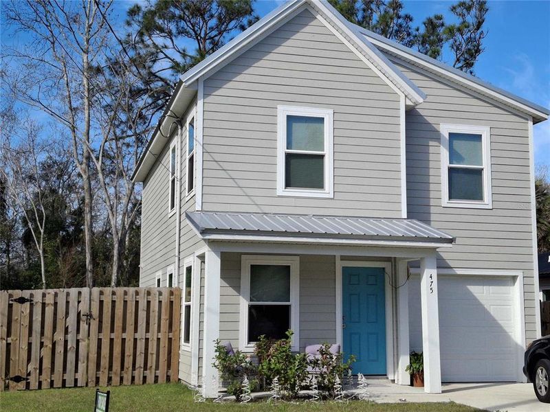 Front exterior of a new home in , St. Augustine, FL, highlighting curb appeal (Image 1).