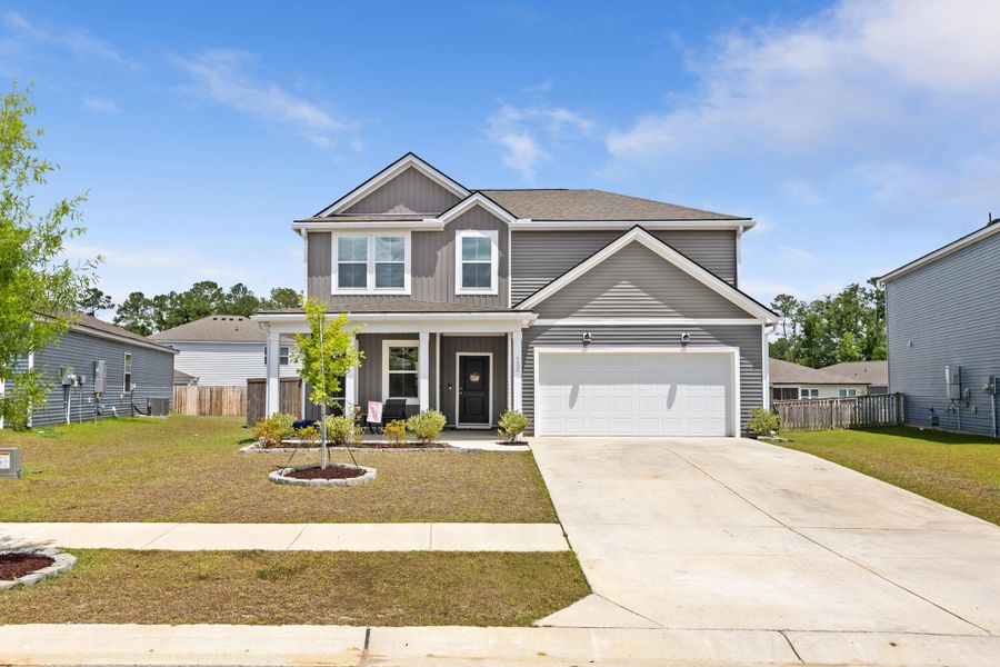 Front exterior of a new home in Bradford Pointe, Summerville, SC, highlighting curb appeal (Image 2). Front exterior of a new home in Bradford Pointe, Summerville, SC, highlighting curb appeal (Image 2).