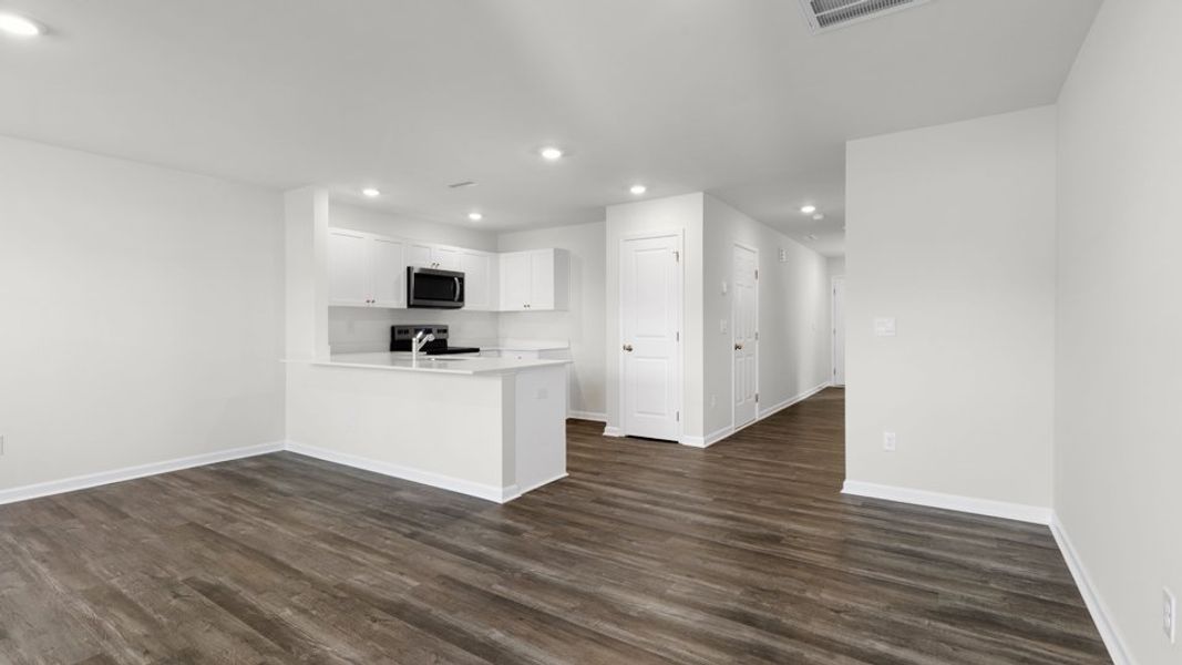 Spacious, unfurnished interior of a new home in The Townes at Belle Grove, Wendell (Image 14).