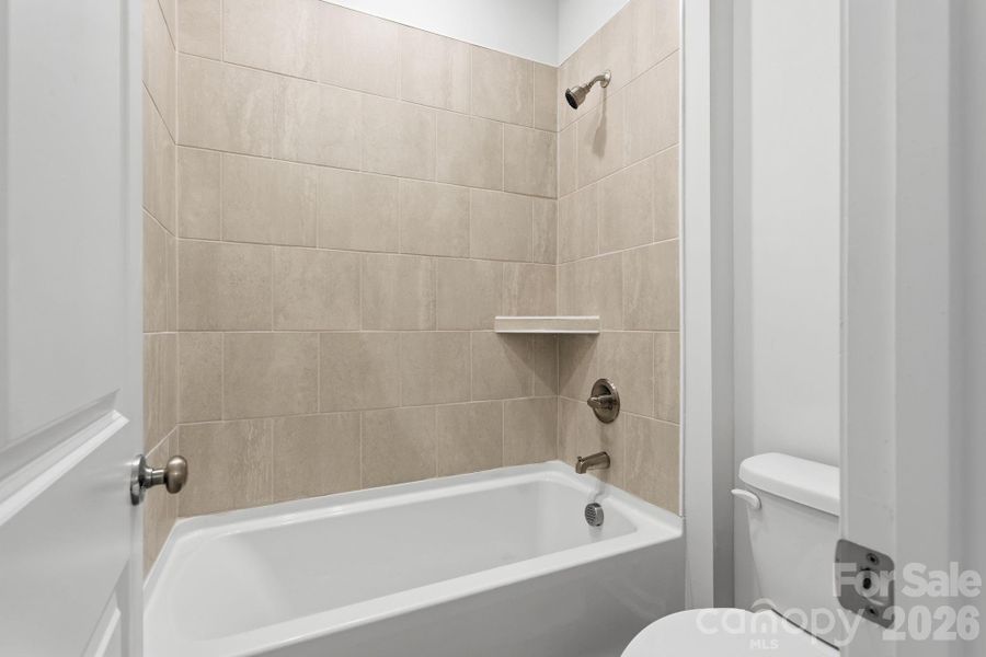 Tile surround in Hall Bath