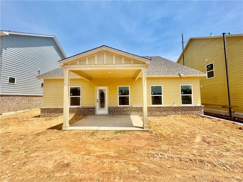 Exterior details and patio area of a home in Eastlyn Crossing, Flowery Branch (Image 10).