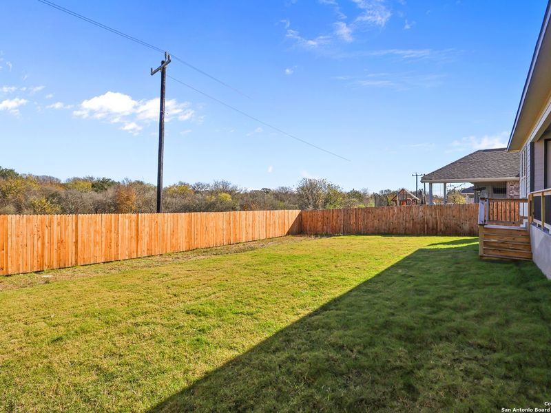Exterior details and patio area of a home in The Reserve at Potranco Oaks, Castroville (Image 28).