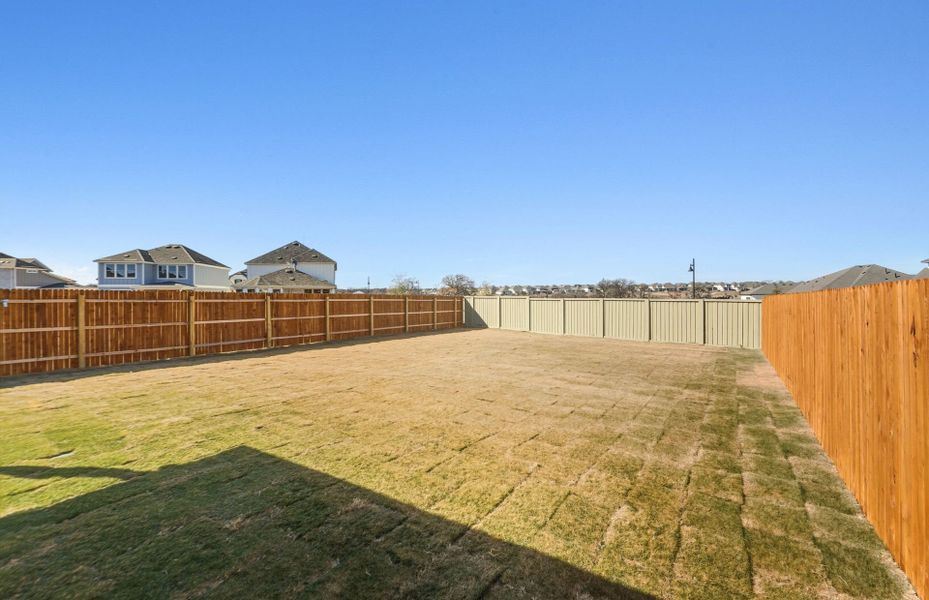 Exterior details and patio area of a home in Santa Rita Ranch, Liberty Hill (Image 25).
