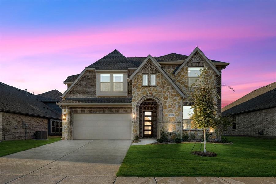 Front exterior of a new home in Woodstone, Providence Village, TX, highlighting curb appeal (Image 2). Front exterior of a new home in Woodstone, Providence Village, TX, highlighting curb appeal (Image 2).