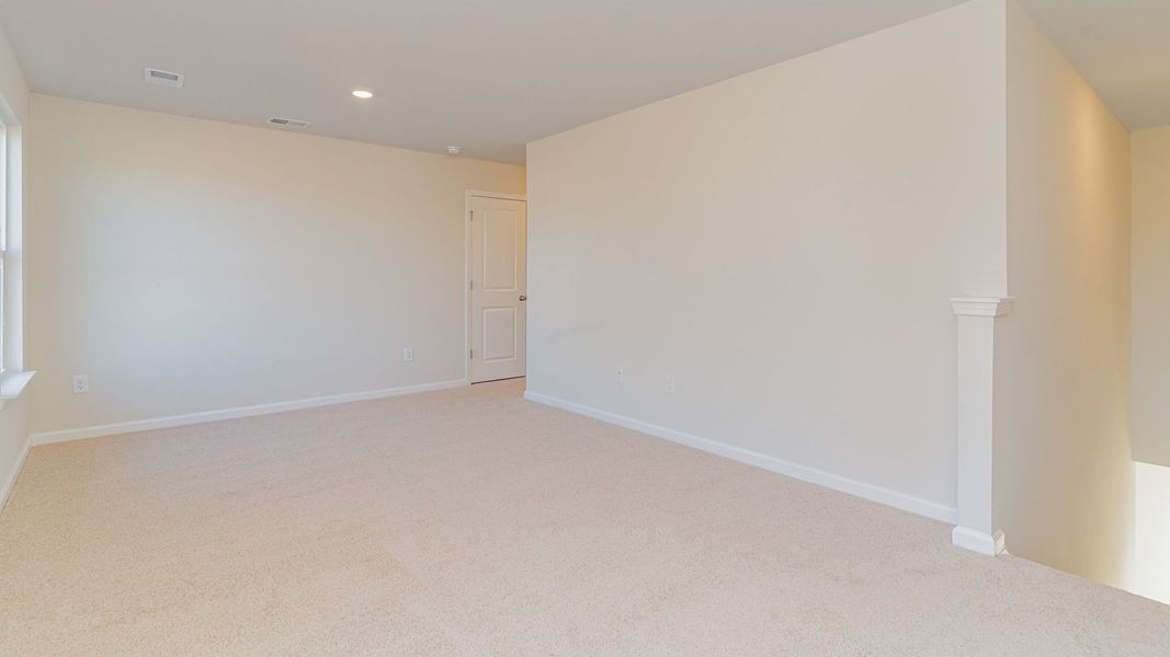 Representative unfurnished interior of a home built from the WREN by D.R. Horton in Saltgrass Landing, Winnabow (Image 26).