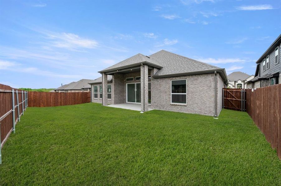 Exterior details and patio area of a home in High Country, Burleson (Image 4).