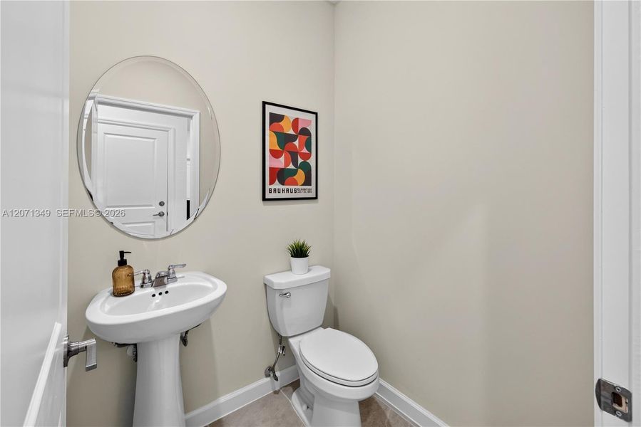 The powder room delivers much-needed convenience and access near the main living area. The powder room delivers much-needed convenience and access near the main living area.