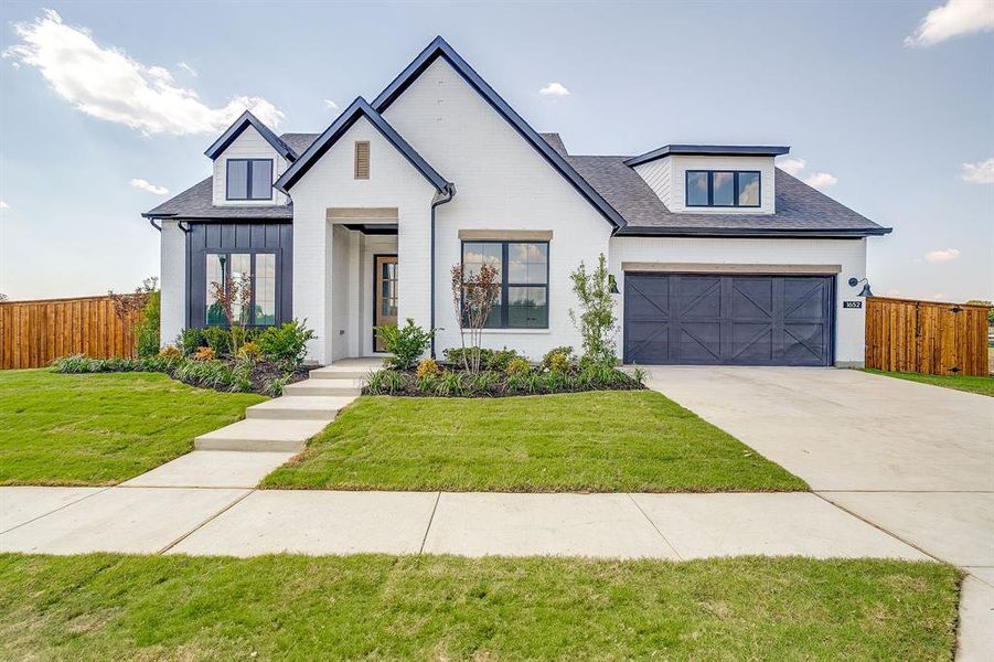 Front exterior of a new home in Pecan Grove, Burleson, TX, highlighting curb appeal (Image 2).