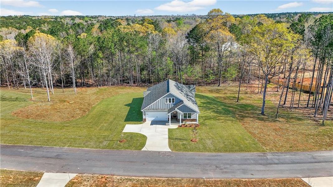 Front exterior of a new home in Waters Edge, Mansfield, GA, highlighting curb appeal (Image 16).