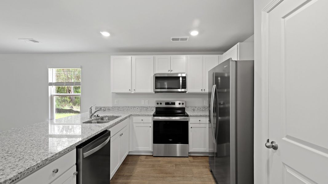 Furnished interior view inside a new home in Pine Hills at Cane Bay, Summerville (Image 6).