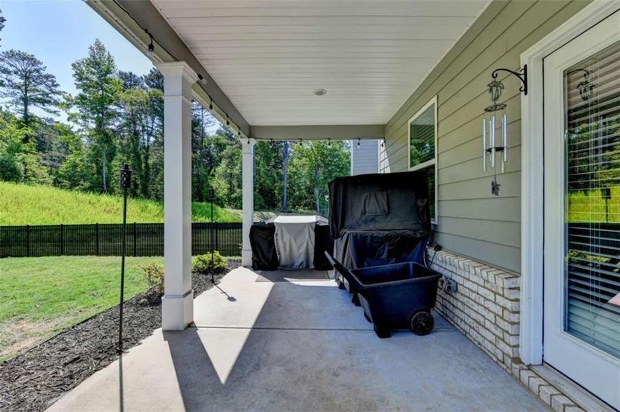 Exterior details and patio area of a home in Twin Lakes, Hoschton (Image 29).