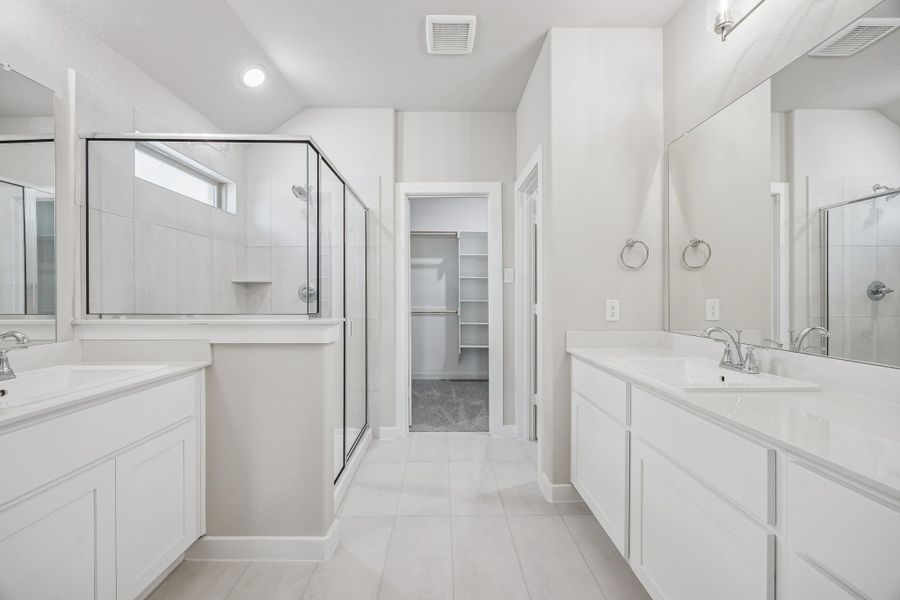 Primary Bathroom in the Heisman home plan by Trophy Signature Homes – REPRESENTATIVE PHOTO