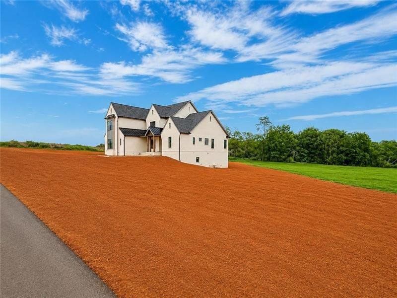 Front exterior of a new home in , Rydal, GA, highlighting curb appeal (Image 12). Front exterior of a new home in , Rydal, GA, highlighting curb appeal (Image 12).