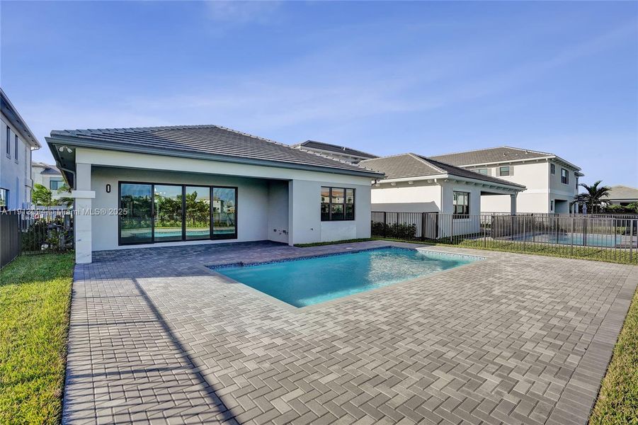 Exterior details and patio area of a home in Apex at Avenir, Palm Beach Gardens (Image 29).