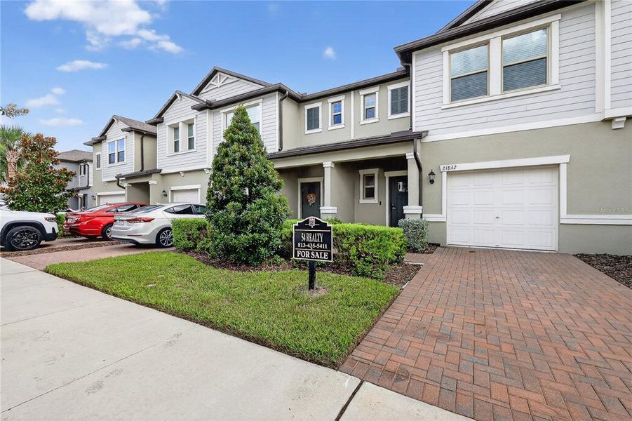 Front exterior of a new home in , Land O' Lakes, FL, highlighting curb appeal (Image 24).