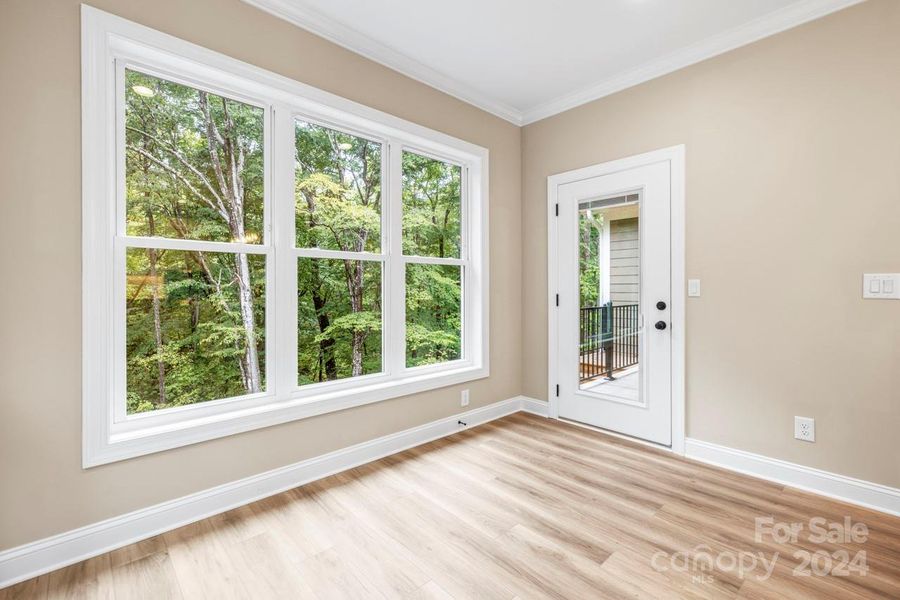 The breakfast area opens to the rear porch, the well thought out glass door gives a view from three sides