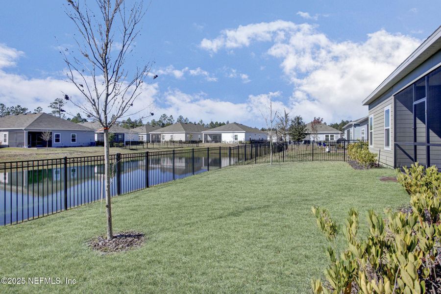 Exterior details and patio area of a home in Tributary: Lakeview at Tributary 60's, Yulee (Image 4).