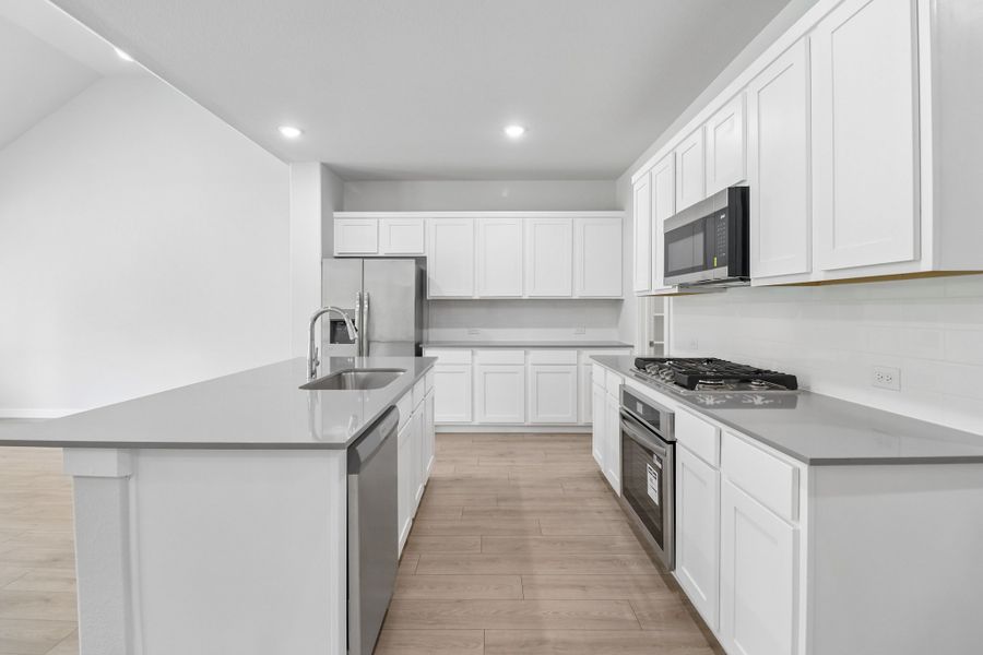 Kitchen in the Masters home plan by Trophy Signature Homes