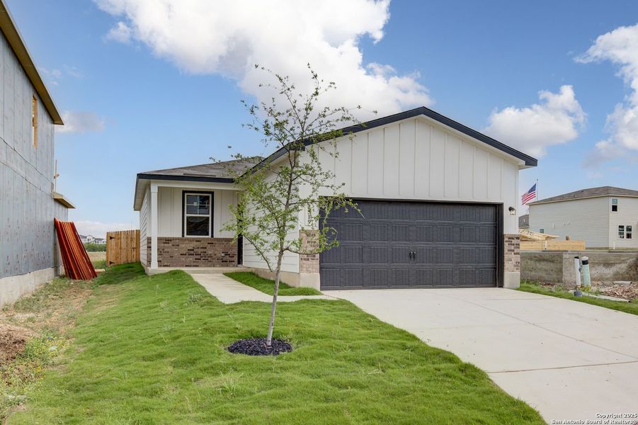 Front exterior of a new home in Applewhite Meadows, San Antonio, TX, highlighting curb appeal (Image 6).