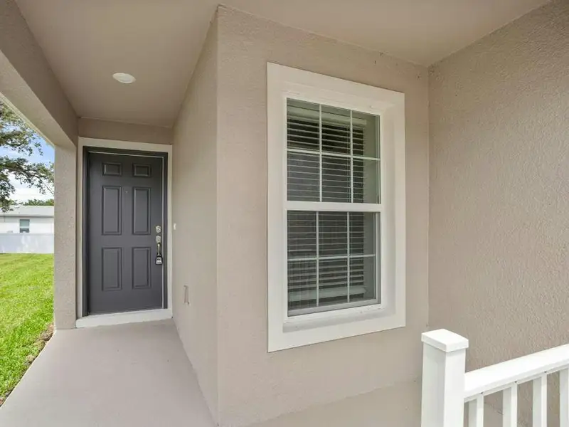 A front porch welcomes you inside.