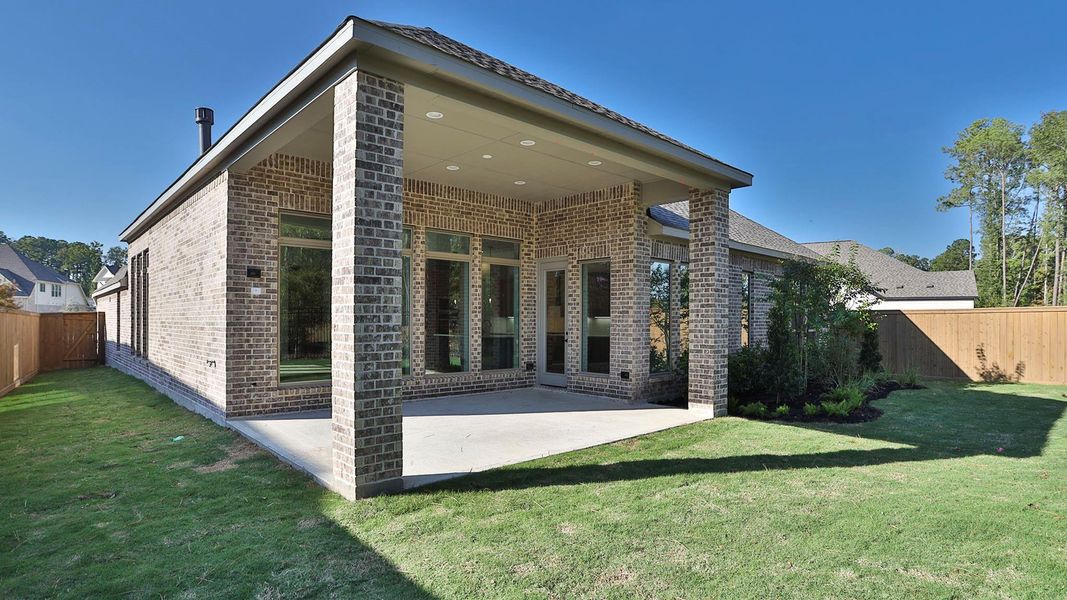 Exterior details and patio area of a home in The Highlands 65', Porter (Image 2).
