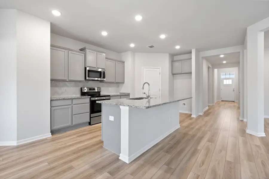 Representative furnished interior of a home built from the Millstone II by Omega Builders in Turnbo Ranch, Killeen (Image 3).