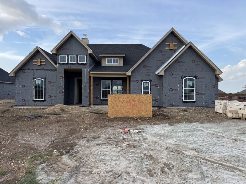 Front exterior of a new home in Coyote Crossing, Godley, TX, highlighting curb appeal (Image 1). Front exterior of a new home in Coyote Crossing, Godley, TX, highlighting curb appeal (Image 1).