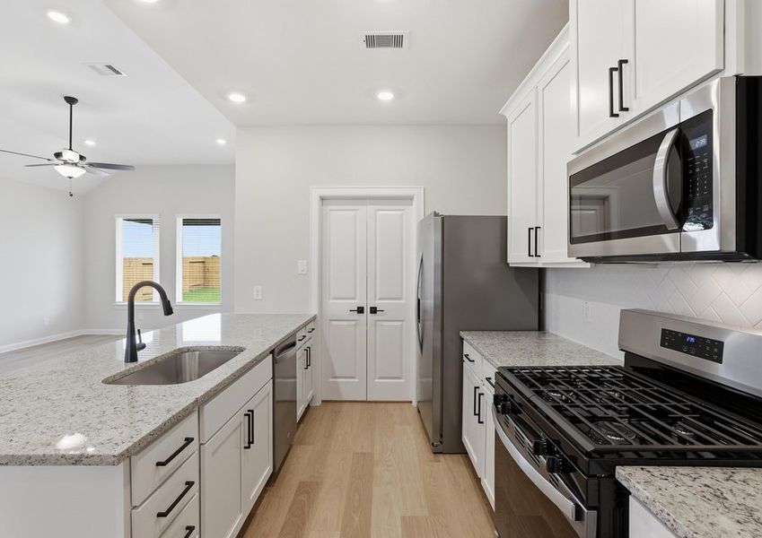 Yaupon - TX | Kitchen – Sink & Gas Range