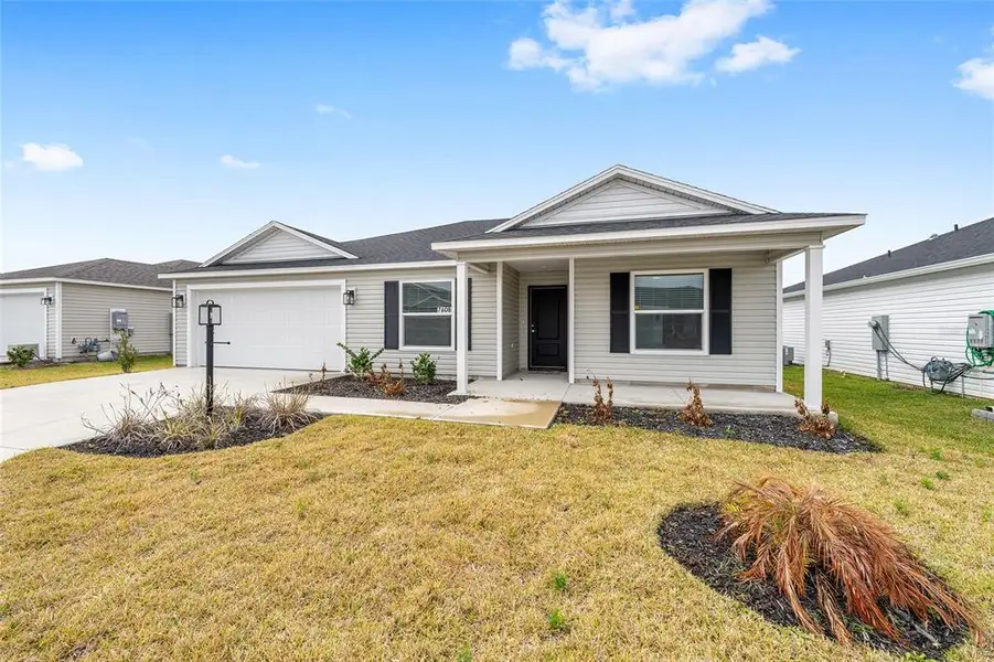 Front exterior of a new home in , The Villages, FL, highlighting curb appeal (Image 17). Front exterior of a new home in , The Villages, FL, highlighting curb appeal (Image 17).