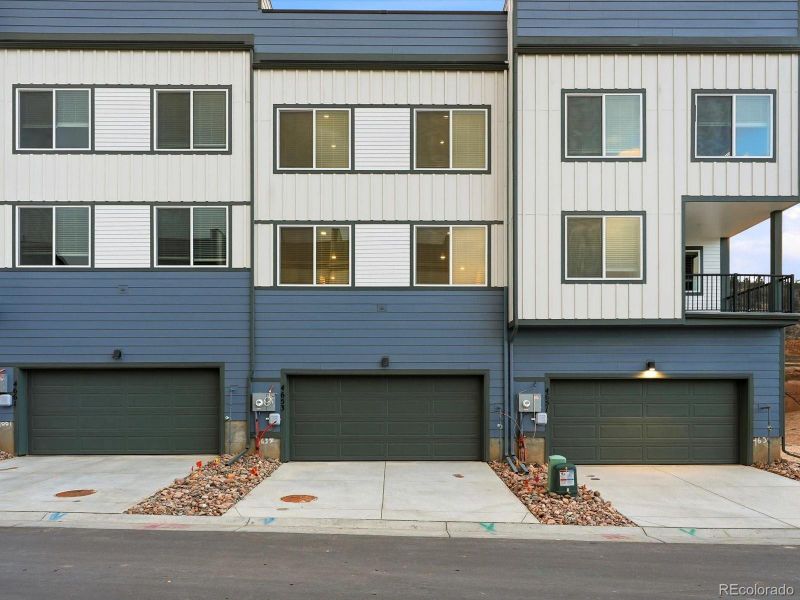 Front exterior of a new home in Three Hills, Morrison, CO, highlighting curb appeal (Image 1). Front exterior of a new home in Three Hills, Morrison, CO, highlighting curb appeal (Image 1).