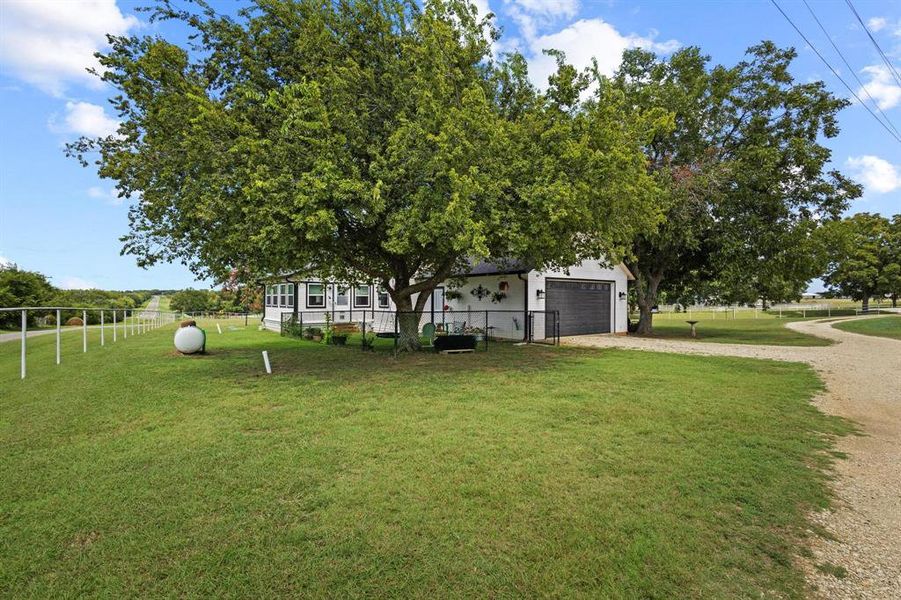 Front exterior of a new home in , Collinsville, TX, highlighting curb appeal (Image 18). Front exterior of a new home in , Collinsville, TX, highlighting curb appeal (Image 18).