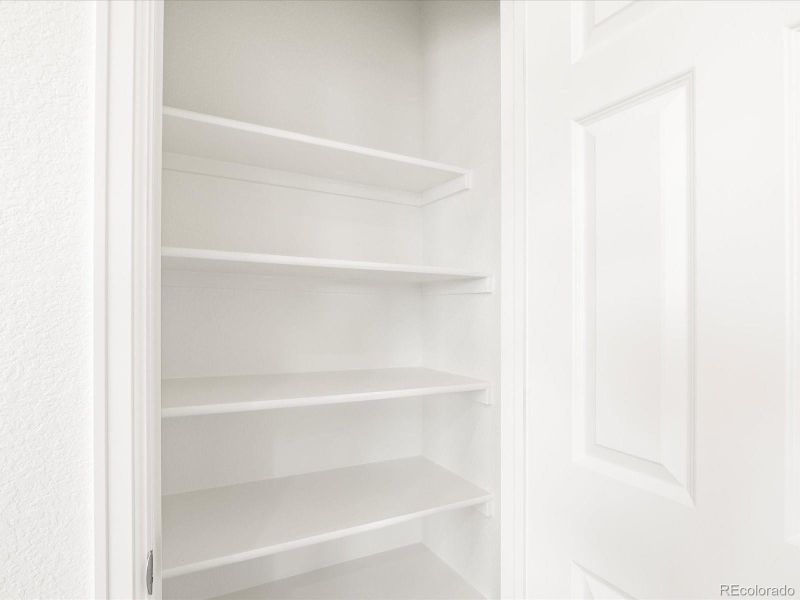 Spacious, unfurnished interior of a new home in Ridgeline Vista: The Flora Collection, Brighton (Image 24).