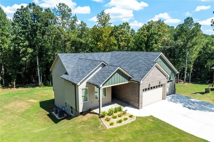 Front exterior of a new home in , Monroe, GA, highlighting curb appeal (Image 26). Front exterior of a new home in , Monroe, GA, highlighting curb appeal (Image 26).
