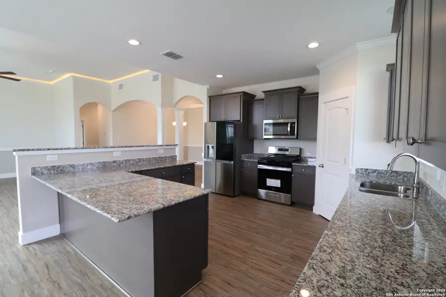 Furnished interior in a model home at Lonesome Dove in San Antonio (Image 3).