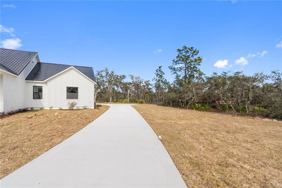 Front exterior of a new home in , Frostproof, FL, highlighting curb appeal (Image 2). Front exterior of a new home in , Frostproof, FL, highlighting curb appeal (Image 2).