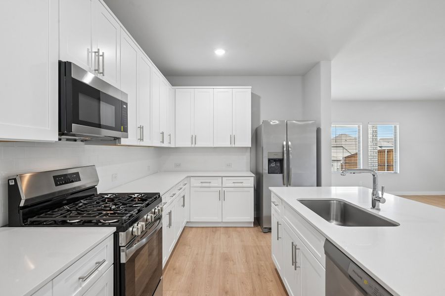 Kitchen in the Hayden home plan by Trophy Signature Homes