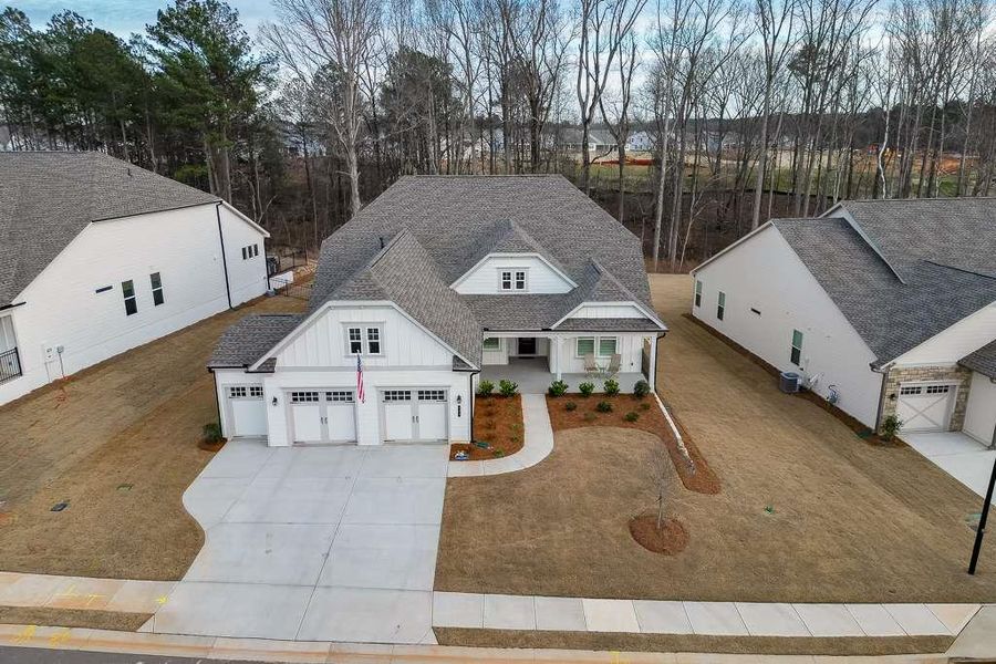 Front exterior of a new home in , Hoschton, GA, highlighting curb appeal (Image 22).