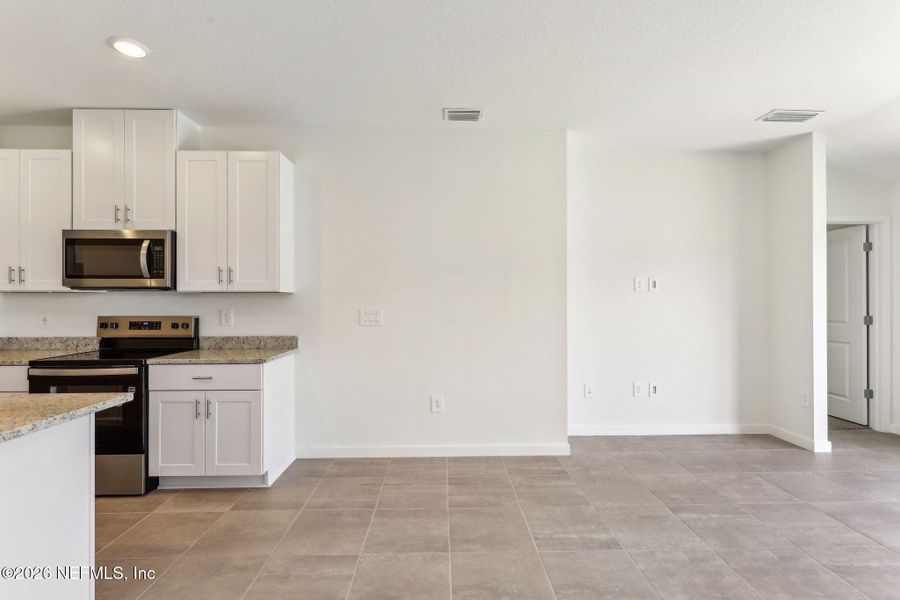 Furnished interior view inside a new home in Flagler Village - Classic Series, Palm Coast (Image 11).