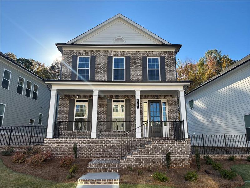 Exterior details and patio area of a home in Brackley Single Family, Cumming (Image 4).
